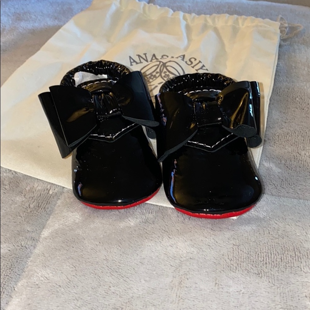 Glossy black baby shoes. Never worn. Size 2